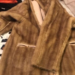 This is a fox mink coat It is designed by John New York